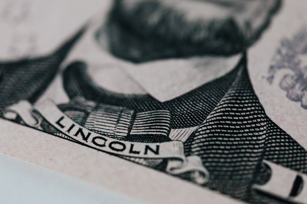 Detailed close-up of Abraham Lincoln's portrait on currency showcasing intricate engraving.